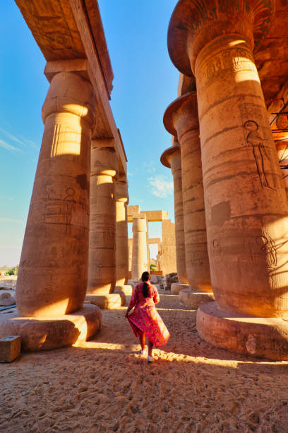 Ramesseum - The Mortuary Temple of Pharoah Ramesses II at Luxor,Egypt Luxor,Egypt,January 1,2020-A visitor enjoys the view of the main hypostyle gallery of the Ramesseum, the Mortuary Temple of Pharoah Ramesses II the Great on a bright afternoon at Luxor, Egypt ramses i stock pictures, royalty-free photos & images