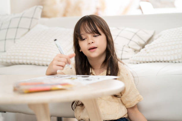 istock Happy daughter learning art drawing at home 2167997911