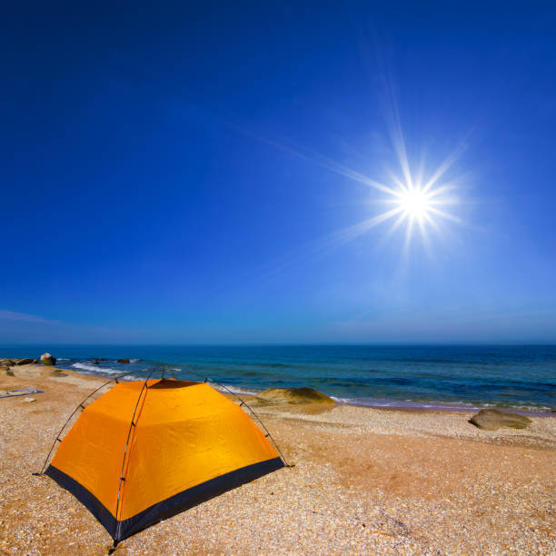 istock closeup touristic tent stay on sandy sea beach at the sunny day 2167998607