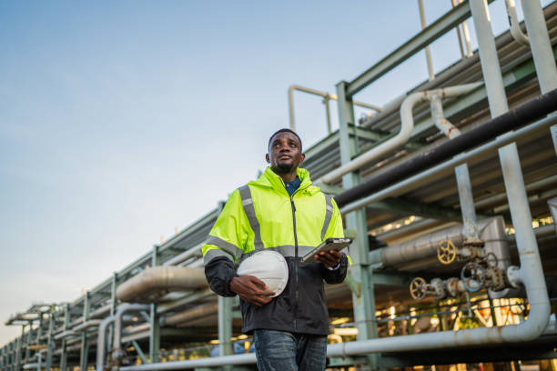 istock Engineer holding blueprint drawing to checking  gas pipeline. 2167999376