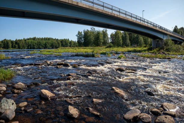 istock bridge over shallow river rapids in Iijoki, Ii Finland 2167999932