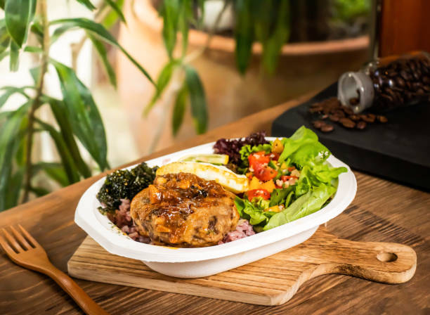 istock hamburger lunch box rice, lemon, herbs and salad served in dish isolated on table side view of taiwan food 2168004669