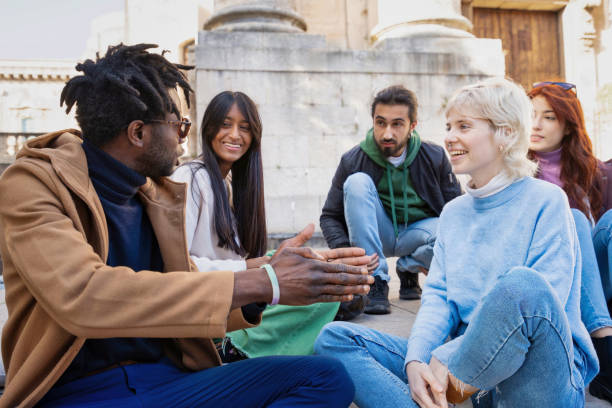 istock Diverse college students socializing on campus: multicultural friendship and inclusion 2168007799