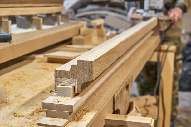 istock Carpenter milling wooden handrail with manual milling machine 2168008441