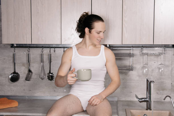 istock A young attractive man is preparing a delicious lunch in the kitchen. 2168009440