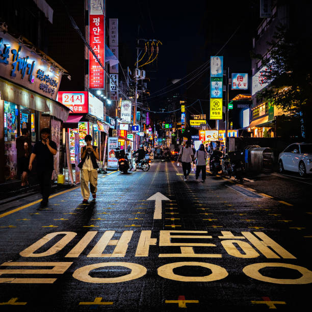 A crowded neon-lit street and nightlife in Gangnam, Seoul, South Korea 08 20 2024, Seoul, South Korea: crowded neon-lit street and nightlife in Gangnam, Seoul kangnamgu stock pictures, royalty-free photos & images