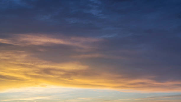 istock Glowing real sky at sunset texture background overlay. Dramatic red and orange clouds. 2168012883