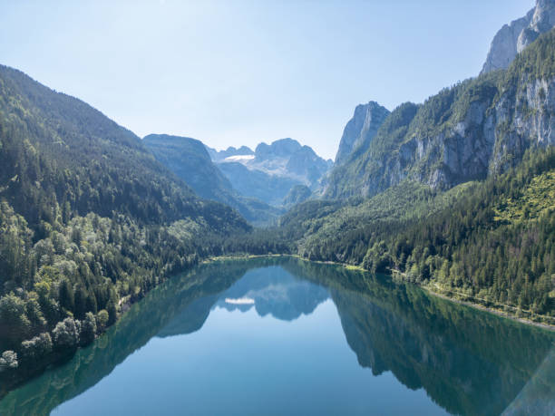 istock Serene Mountain Lake with Majestic Peaks 2168014922