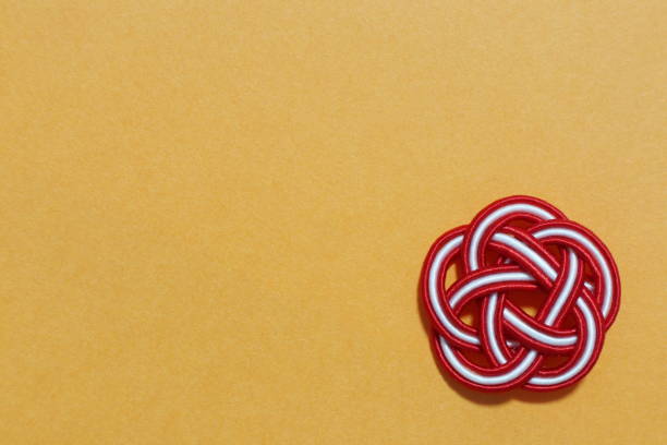 istock Flower-shaped ornament. Background color is orange. 2168015337