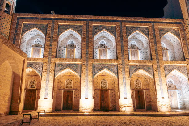 istock A building with arched windows and doors lit up at night. The building is old and has a lot of detail 2168018930