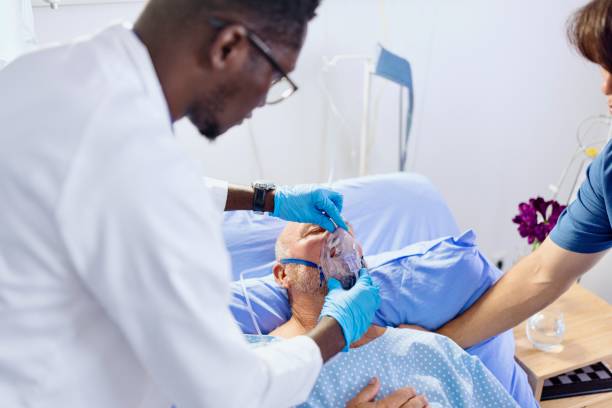 istock Close-up of a doctor helping a man with breathing problems 2168019471