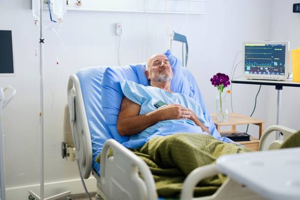 istock Patient hugging phone after talking with his family 2168019619