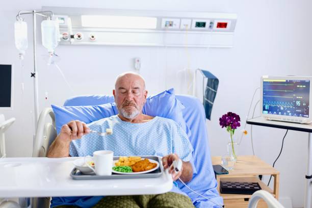 istock Front view of a patient having lunch in the hospital 2168019727
