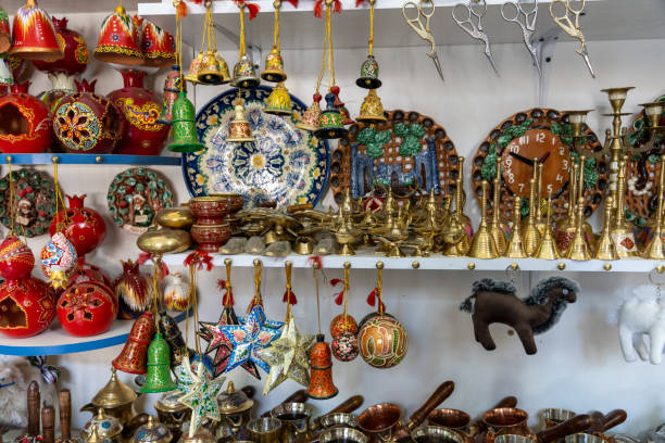 istock A display of various items including a clock and a camel figurine. The items are arranged on shelves and are colorful 2168019861