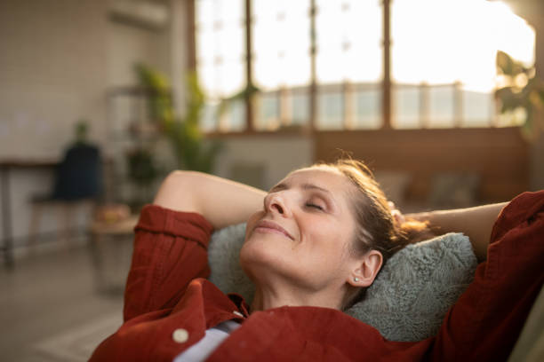 istock Woman relaxing at home 2168020261