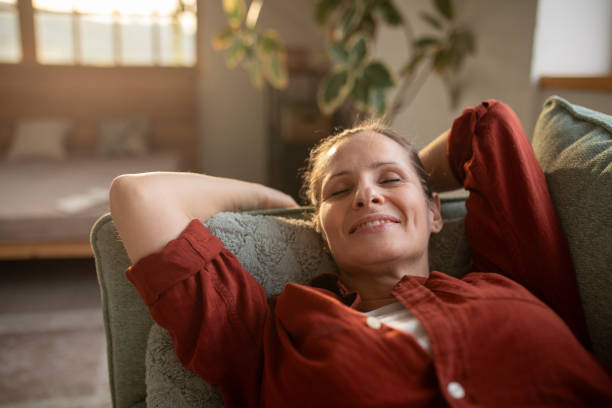 istock Woman relaxing at home 2168020283
