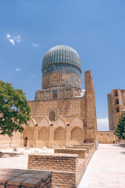 istock A large building with a dome on top and a courtyard in front of it. The courtyard is empty and the sky is blue 2168022239
