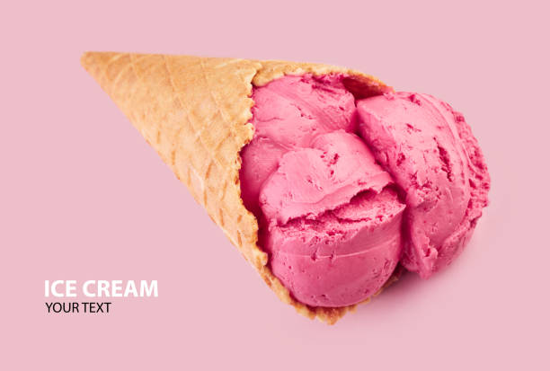 ice cream balls in a Waffle Cone on a pink Background. fruit ice cream in a waffle cone.