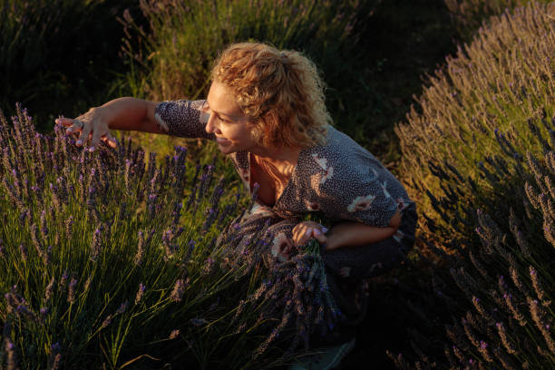 istock Woman enjoying herself in a lavender field 2168023126