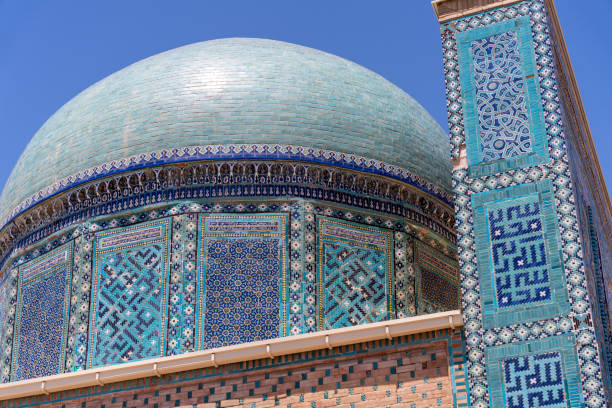 istock A blue dome with intricate designs sits atop a building. The building is decorated with blue tiles and has a tall, narrow tower. Scene is one of grandeur and elegance 2168025654