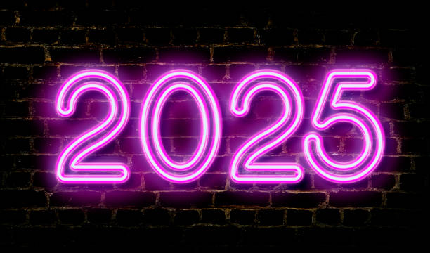 istock Night image of the number 2025 in pink neon text on a brick wall. 2168036719