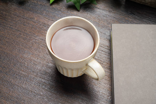 istock Hot cocoa isolated on wooden table 2168039531