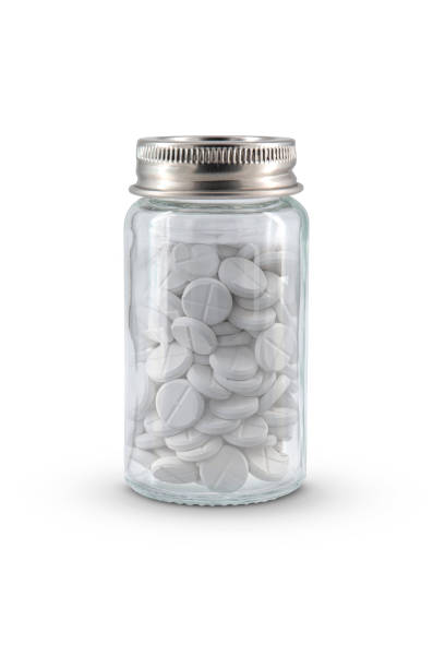 istock small medicine pills glass bottle isolated on white background 2168044001