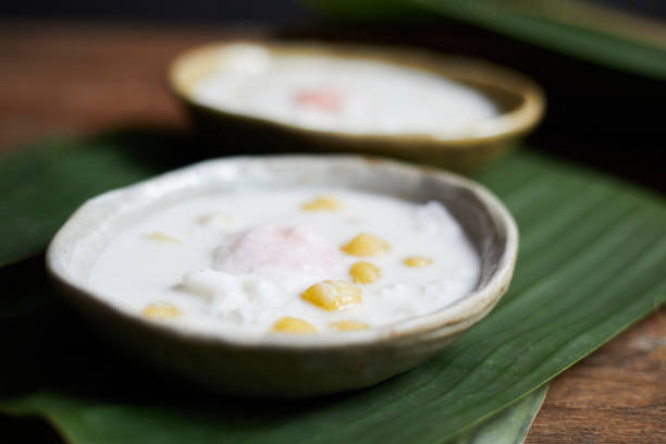 istock Thai glutinous rice balls with coconut milk on wood 2168045243