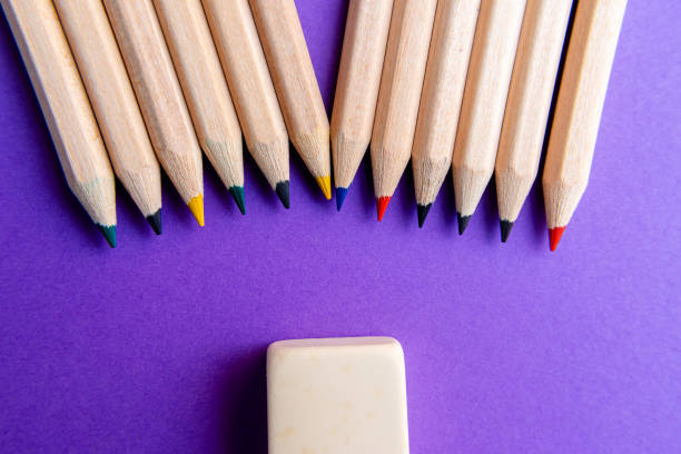 istock Colored multi-colored pencils on a purple background. back to school. Top view. 2168045704