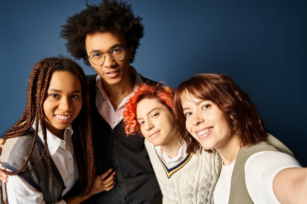 istock Multicultural college students and their queer friend embracing creativity in a studio 2168048884