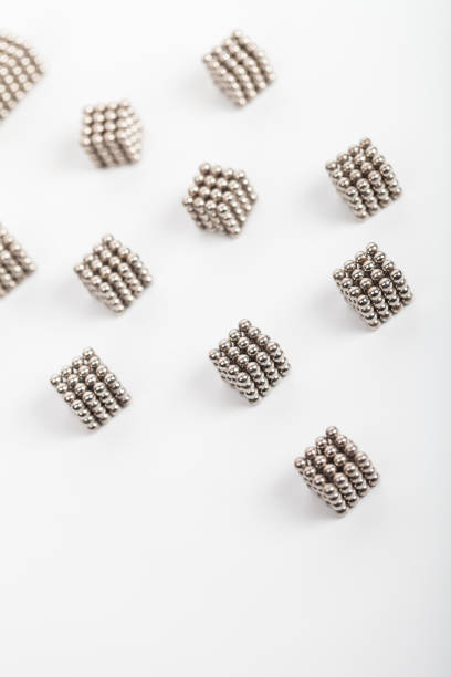 istock cubic composed with magenetic balls random arranged on white background 2168050129