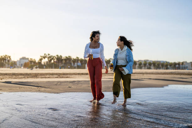 istock Joyful Hispanic Women Spending Time Together at Seaside 2168054870