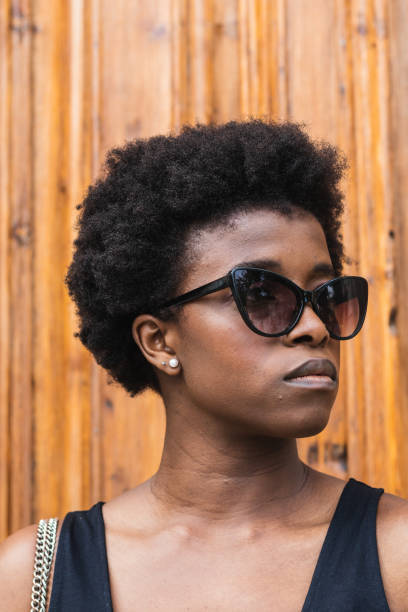 istock Sad black woman with Afro hairstyle looking at camera 2168055401
