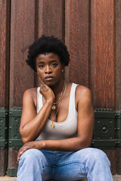 istock Sad black woman with Afro hairstyle looking at camera 2168055511