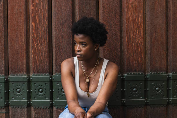 istock Sad black woman with Afro hairstyle looking away 2168055558