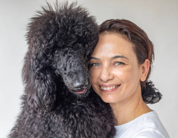 istock Woman and Poodle 2168055915