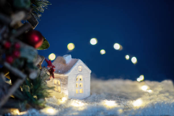 istock house with snow and decoration x-tree background blue 2168056322