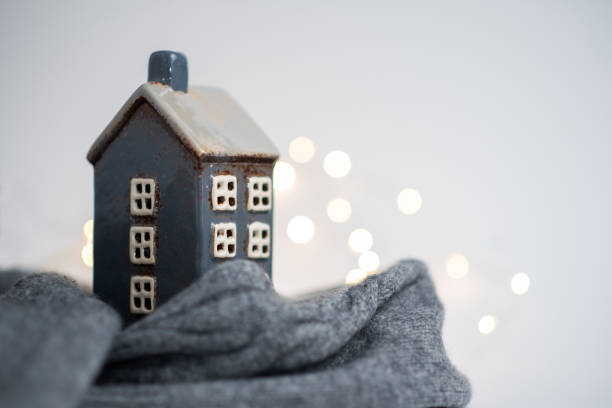 istock cozy house wrapped in a sweater with white ligh 2168056736