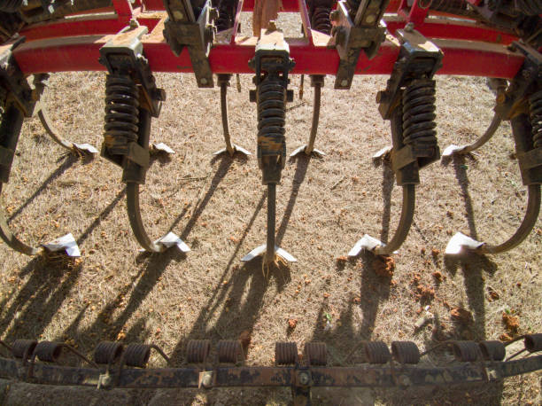 Cultivator, a farm implement used for breaking up soil clods