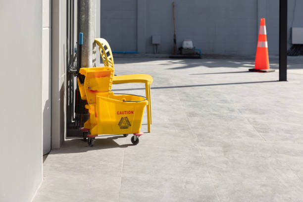 istock A yellow mop bucket with a sign on it that says Caution 2168060172