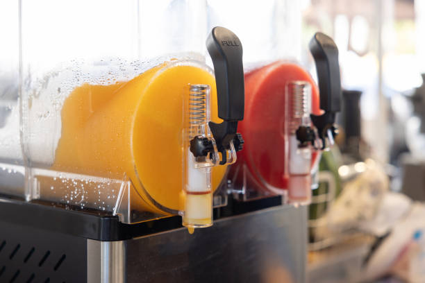 istock Two juice dispensers with one orange and one red 2168060177