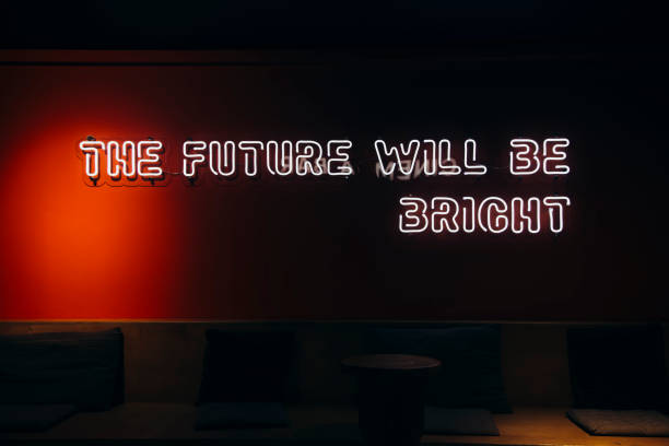 istock Neon sign phrase The future will be bright on black background isolated. 2168060863