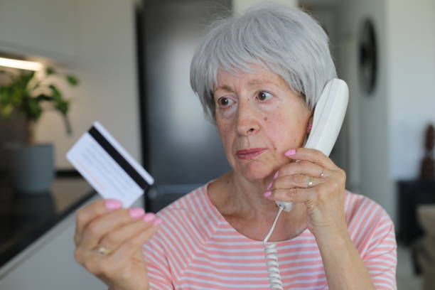 istock Skeptical looking senior woman during phone call 2168061313