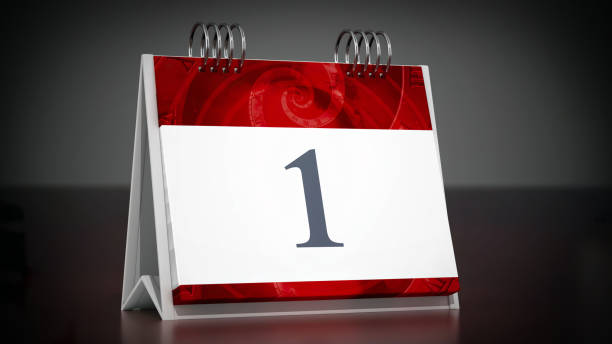 Desktop calendar page with number one on dark background.