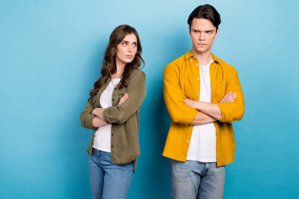 istock Photo of two best friends dissatisfied argue conflict problem relationship no support misunderstanding folded hands isolated on blue color background 2168065278