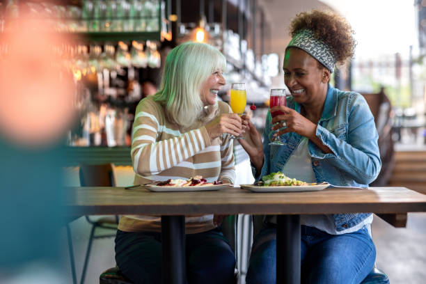 istock Friends Bursting into Laughter Over Brunch 2168066530