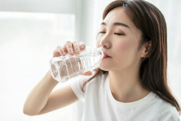 istock Beautiful young asian woman who drinks water 2168068654