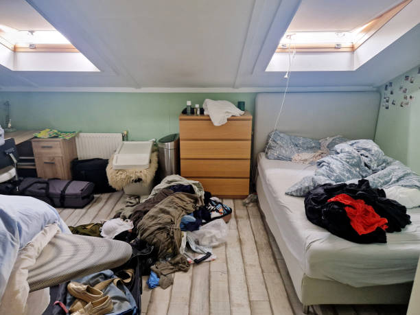Room is untidy with all clothes that were laundry but cannot manage to the closet