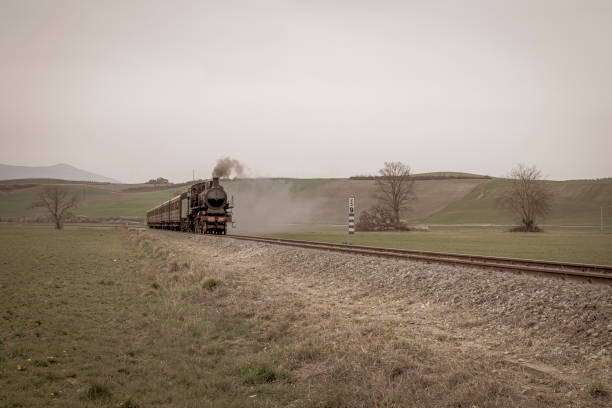 istock Val d'Orcia, Tuscany, Italy:An old steam train runs through Val d'Orcia 2168072423