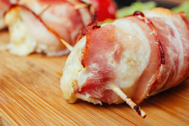 Bacon-wrapped chicken breast roasted to perfection in oven, fatty bacon and juicy chicken breast, delicious baked recipe